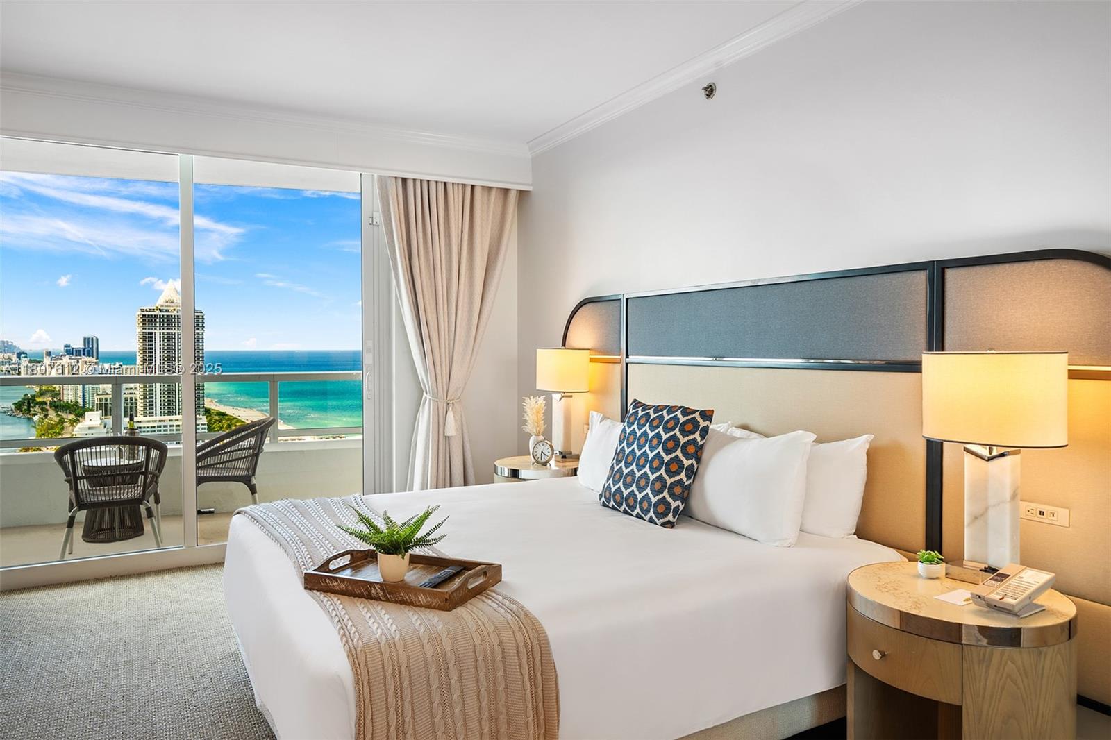 A hotel bedroom features a king bed, bedside tables, and a balcony overlooking the ocean — 4401 Collins Ave # 3505, Miami Beach FL 33140, MIAMI BEACH, FL
