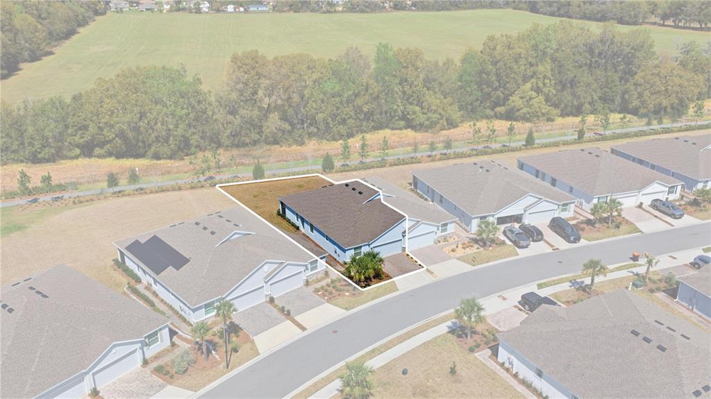 An aerial view shows a single-story house with a brown roof and a small yard — 5369 NW 48TH PLACE, OCALA, FL