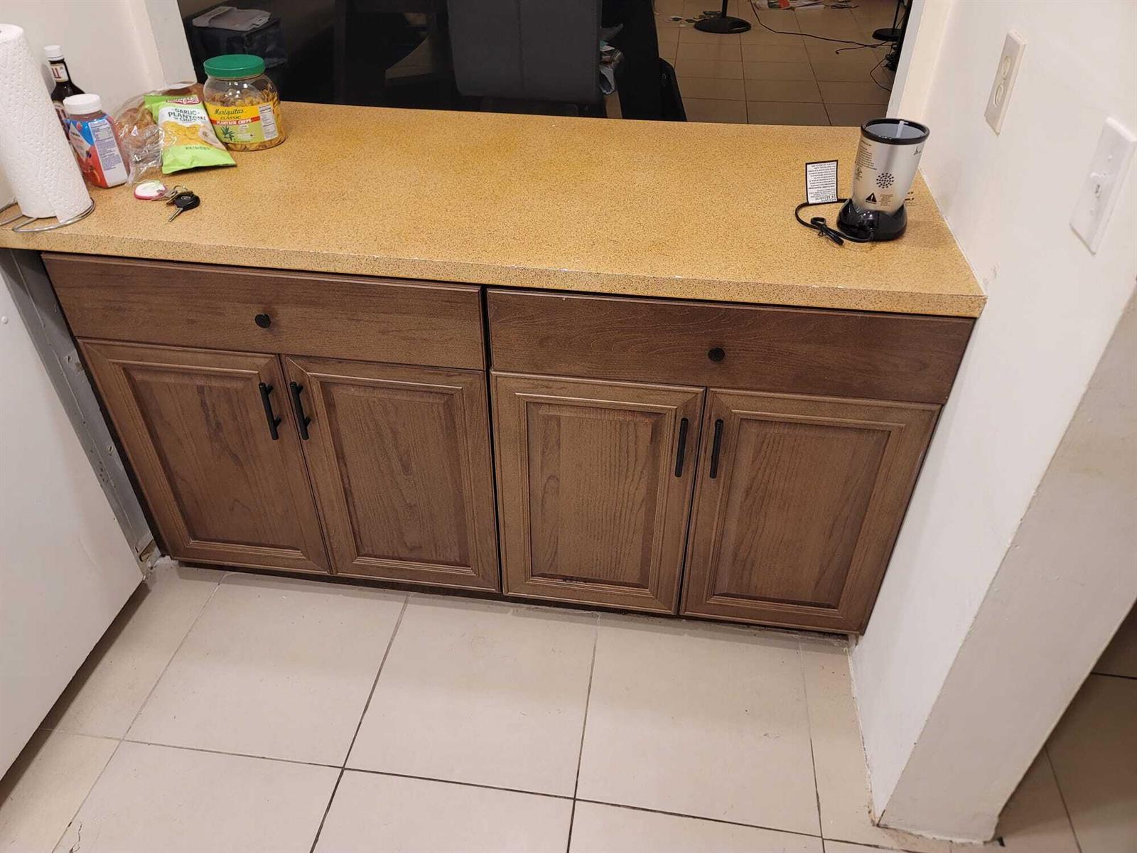 A kitchen counter with wood cabinets and a speckled tan countertop — 6501 Winfield Boulevard # 40, Margate FL 33063, MARGATE, FL