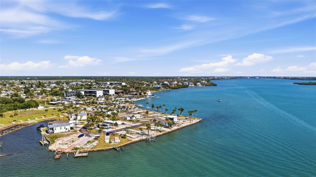 An aerial view shows a coastal mobile home park situated on a point of land — 7500 PARK POINTE DRIVE UNIT 49, ENGLEWOOD, FL