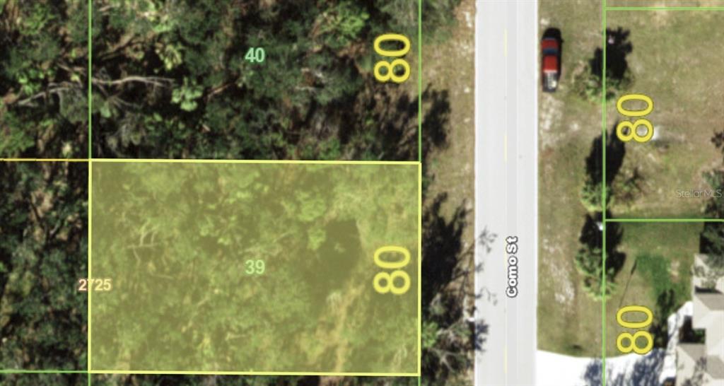 This is a map showing a rectangular land parcel highlighted in yellow along a street — 3067 COMO STREET, PORT CHARLOTTE, FL