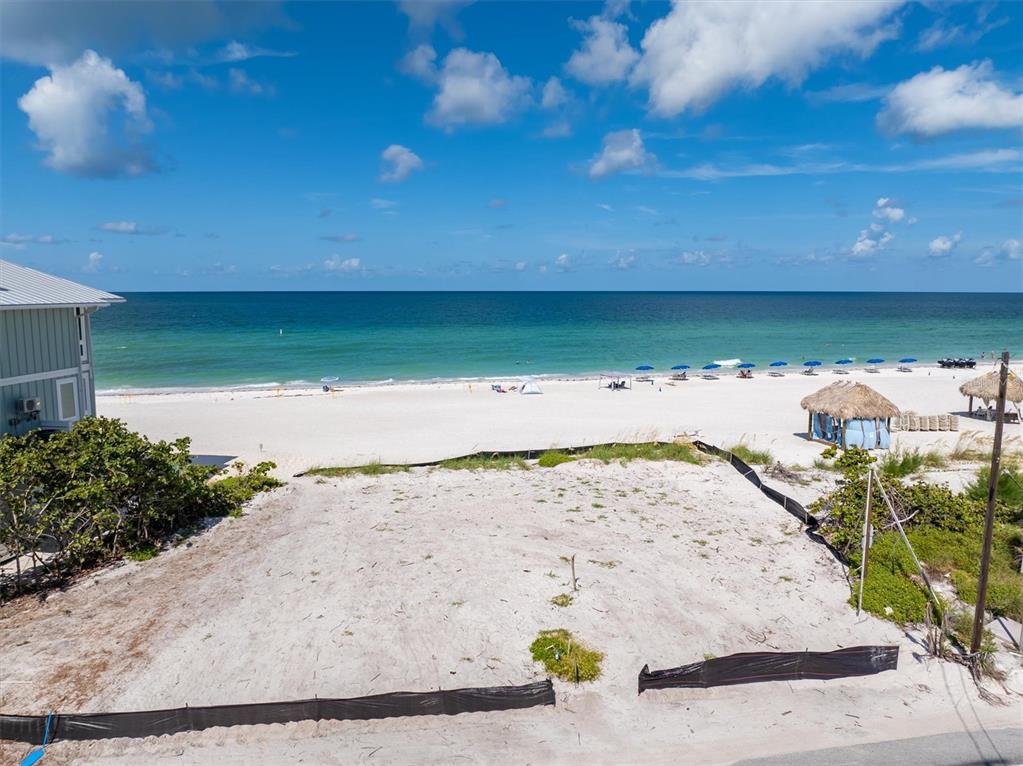 An elevated view of a vacant, sandy beachfront lot overlooking the ocean — 1200 GULF DRIVE N, BRADENTON BEACH, FL