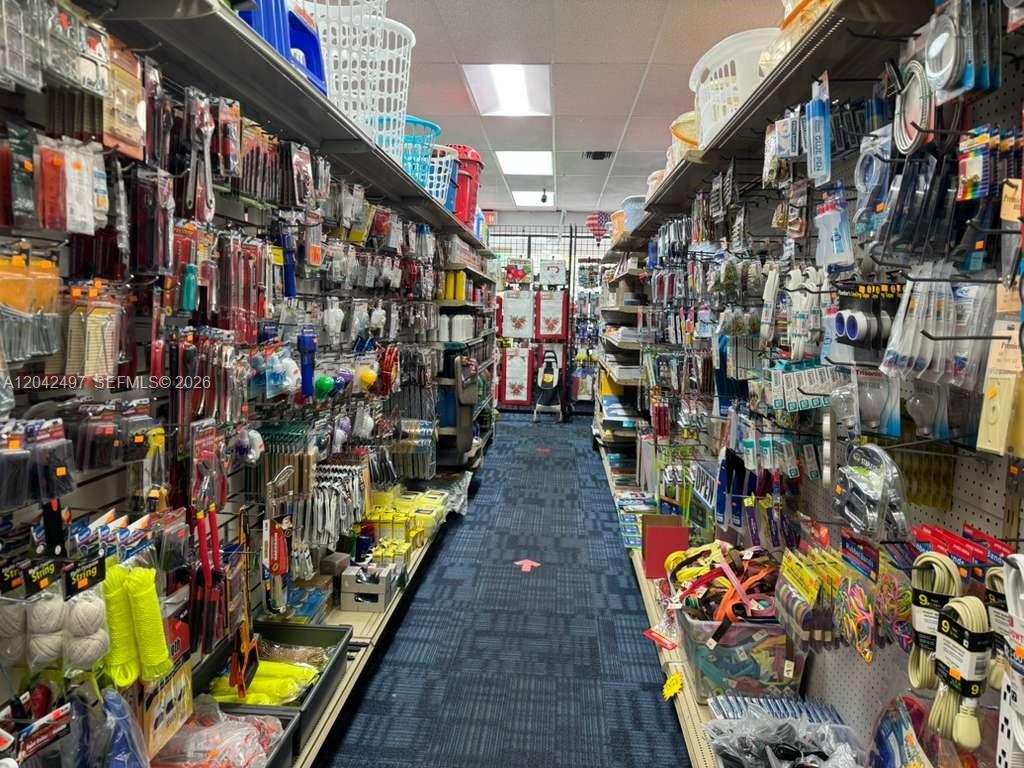 An aisle in a retail store is lined with shelves stocked with various hardware products — Convenience Store for Sale, Kendall FL 33175, KENDALL, FL