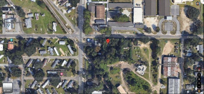 This is an aerial map view showing a wooded lot located near a street intersection — 3504 E 5TH STREET, PANAMA CITY, FL