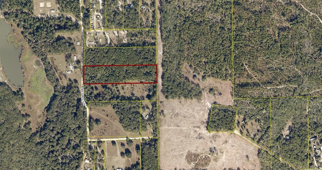 An aerial map view shows a rectangular wooded lot outlined in red — 0 SUNTILT COURT, WHITE SPRINGS, FL
