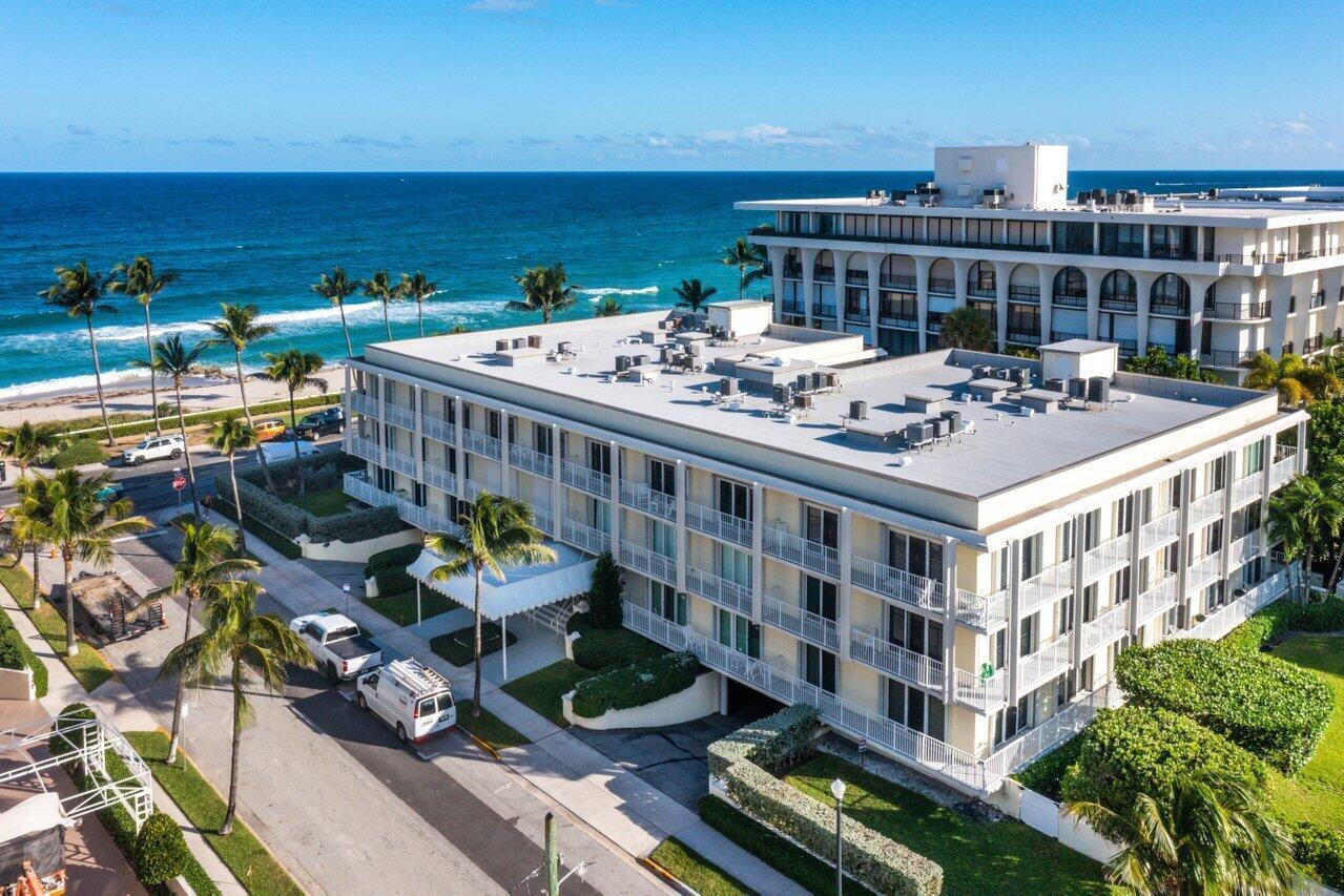 An aerial view of a multi-story hotel building located next to a sandy beach — 350 S Ocean Boulevard # 201, Palm Beach FL 33480, PALM BEACH, FL