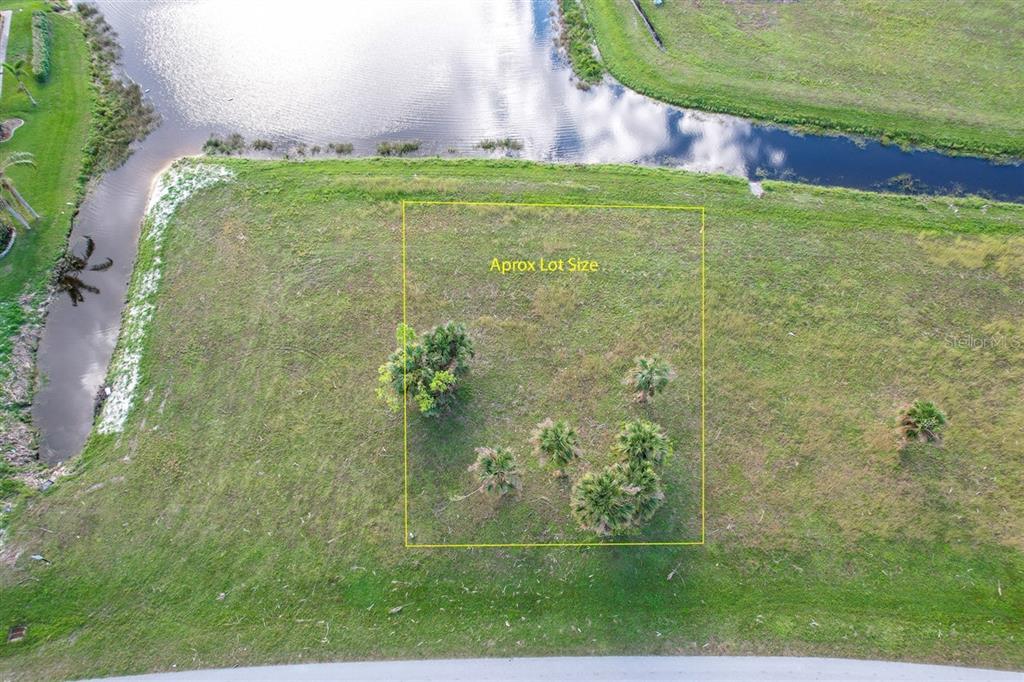 An aerial view shows a rectangular plot of land marked by a yellow outline — 16208 SAN EDMUNDO ROAD, PUNTA GORDA, FL