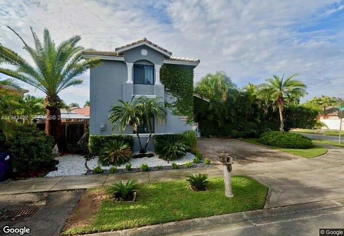 A two-story gray house with a palm tree and a paved driveway — 15448 SW 92nd St, Miami FL 33196, MIAMI, FL