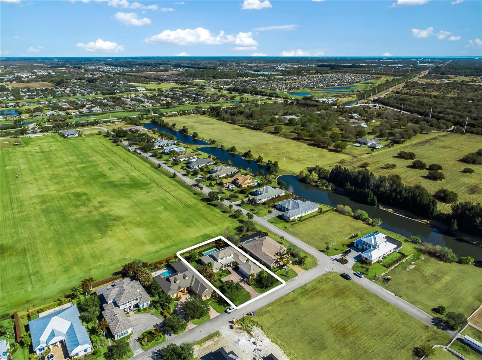 An aerial view shows a residential house with a pool highlighted by a white border — 7634 S Polo Grounds Lane, Vero Beach FL 32966, VERO BEACH, FL