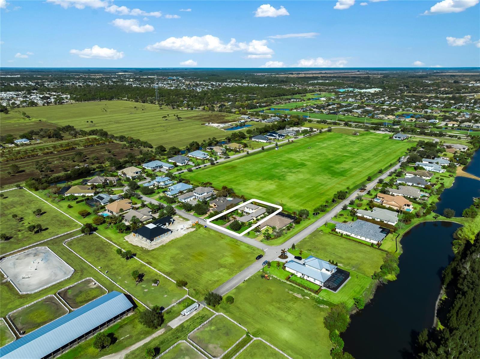 An aerial view shows a residential property highlighted in white within a rural neighborhood — 7634 S Polo Grounds Lane, Vero Beach FL 32966, VERO BEACH, FL