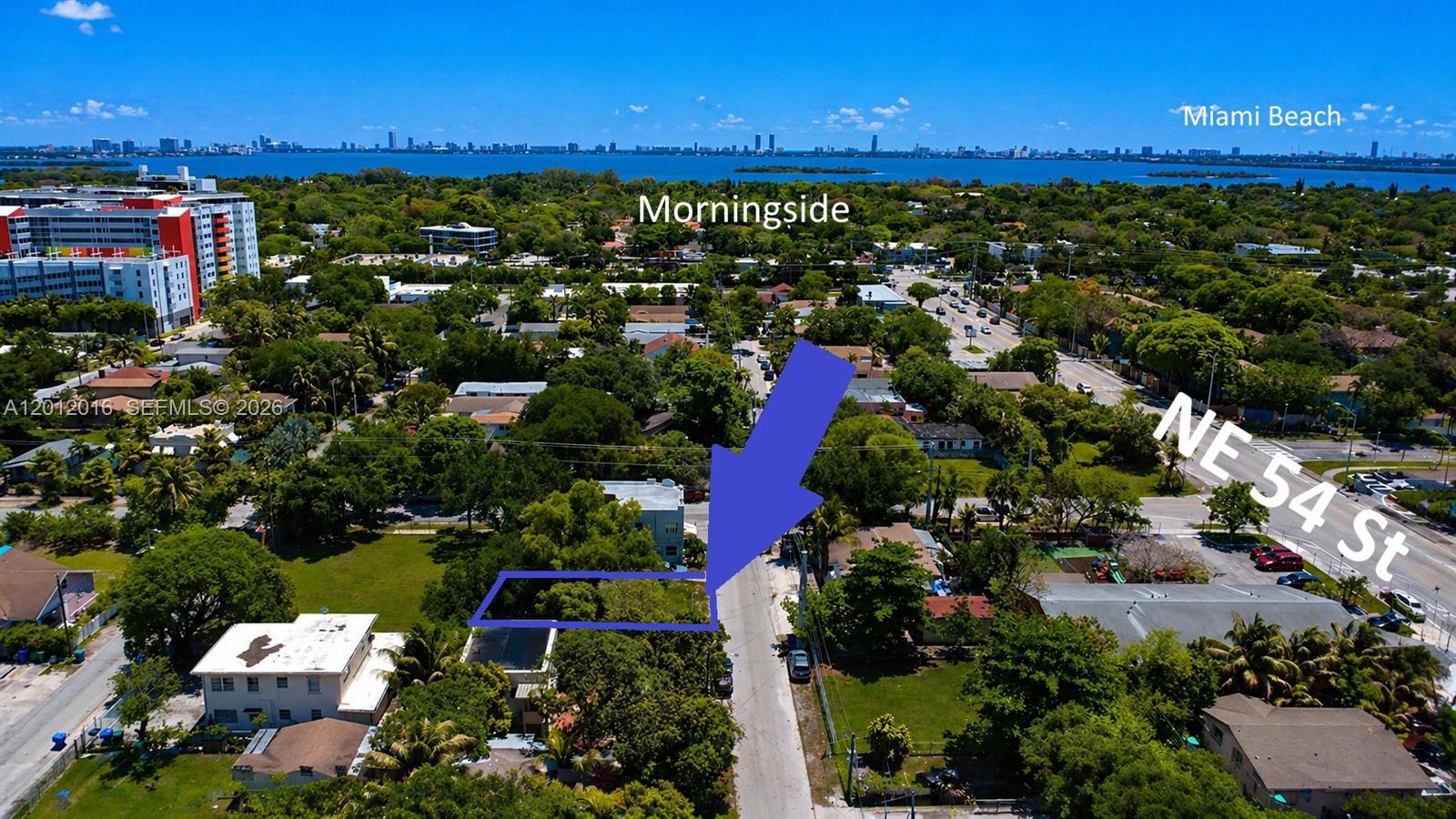 An aerial view shows a vacant residential lot outlined in blue within a neighborhood — 285 NE 55th St, Miami FL 33137, MIAMI, FL