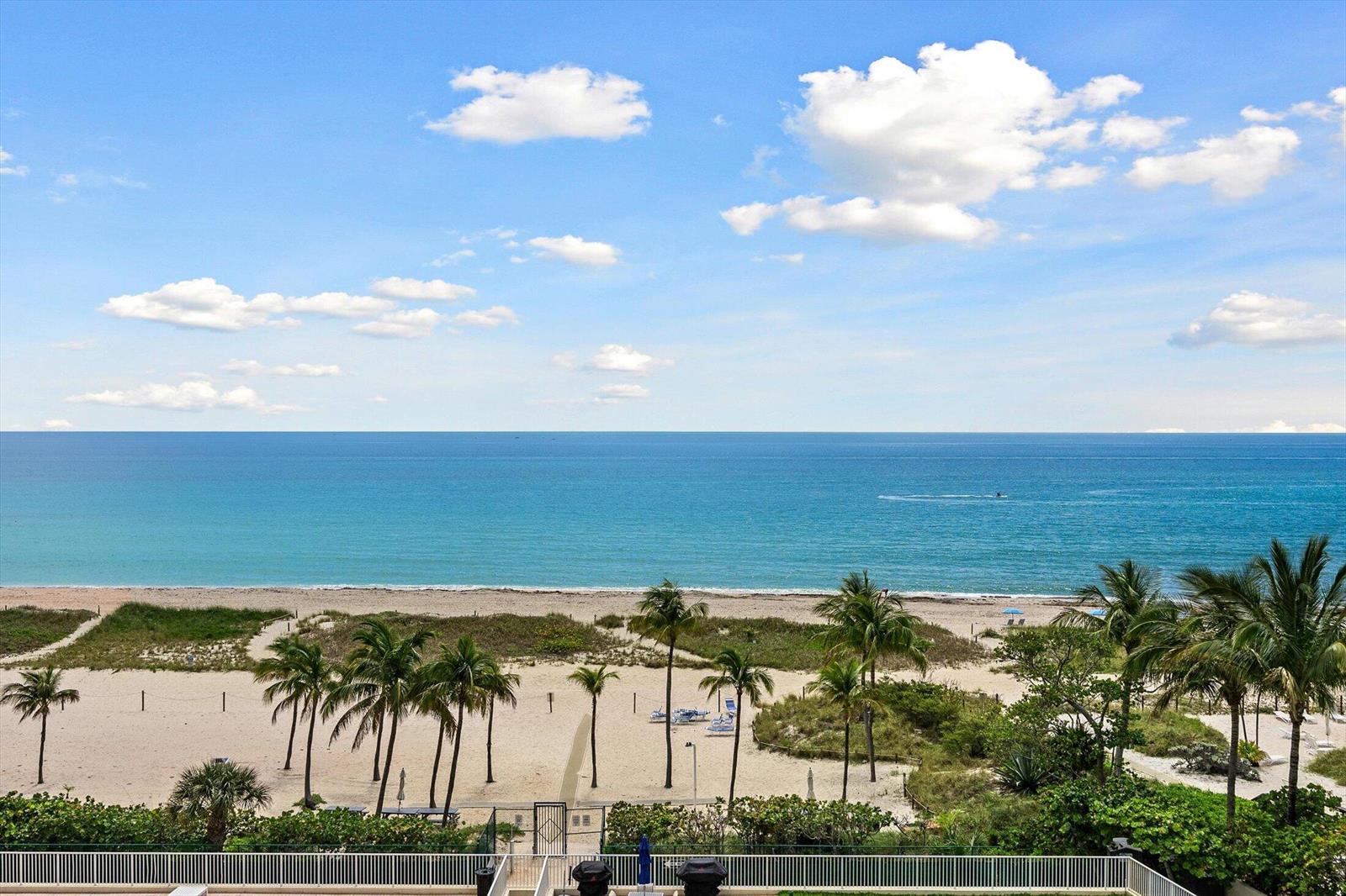 An elevated view of a sandy beach with palm trees overlooking the ocean — 750 N Ocean Boulevard # 710, Pompano Beach FL 33062, POMPANO BEACH, FL