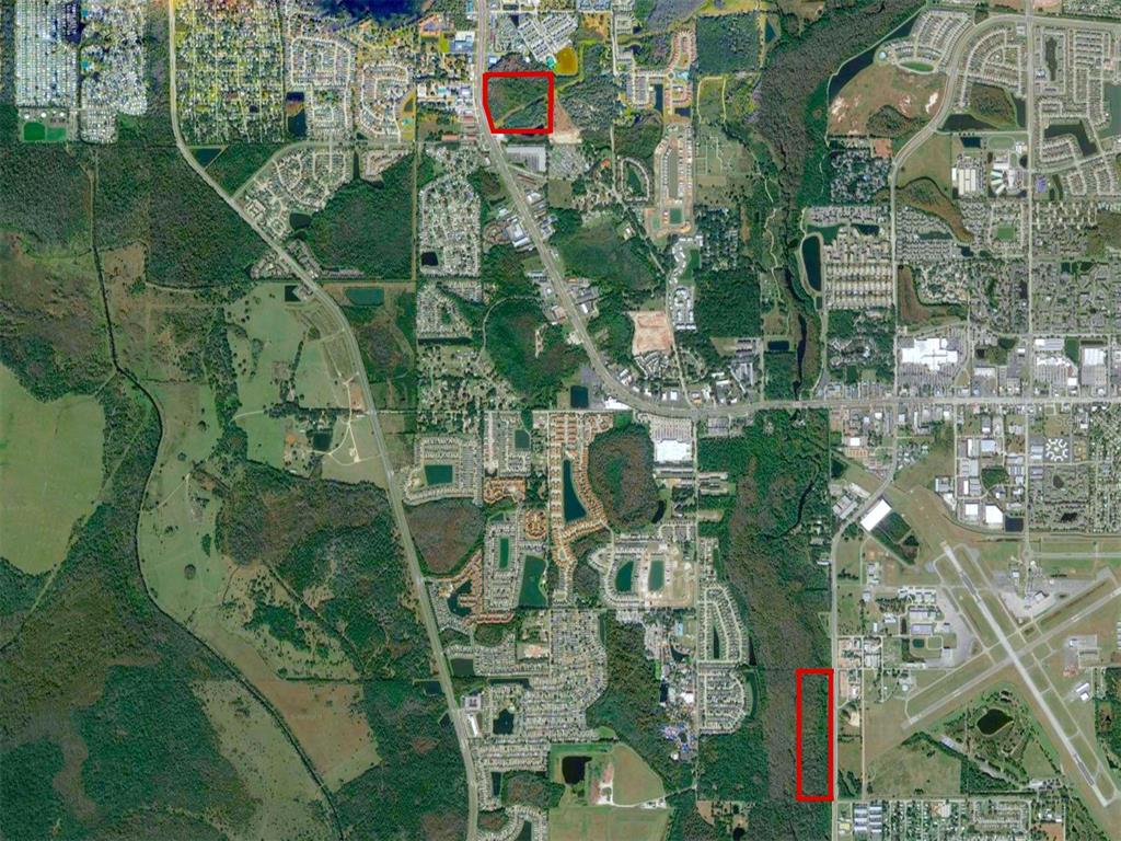 This aerial map shows two red-outlined parcels of land surrounded by residential and commercial development — 200 N HOAGLAND BOULEVARD, KISSIMMEE, FL