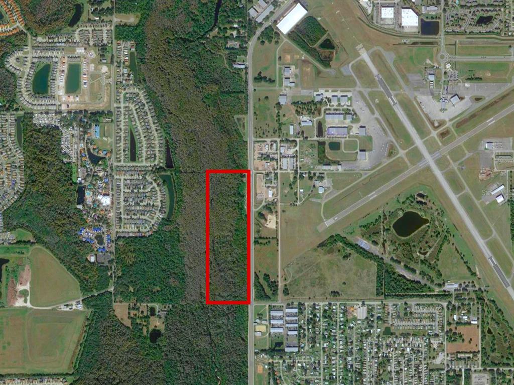 An aerial map shows a rectangular plot of land outlined in red next to a road — 200 N HOAGLAND BOULEVARD, KISSIMMEE, FL