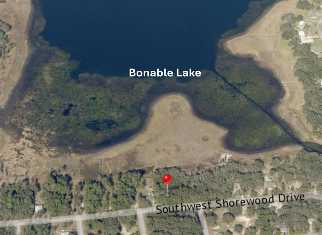 This aerial map shows a vacant lot located on the shore of Bonable Lake — LOTS 476 & 477 SW SHOREWOOD DRIVE, DUNNELLON, FL