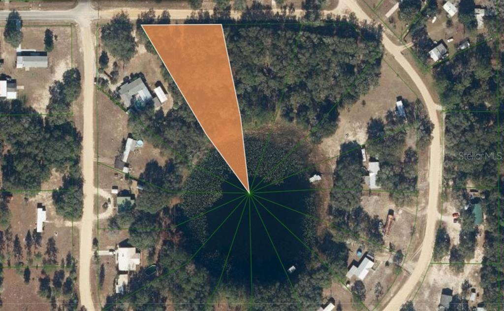 An aerial map shows a wedge-shaped property lot bordering a circular lake — 503 64TH STREET, INTERLACHEN, FL