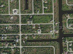An aerial map view shows residential lots, streets, and canals in a suburban neighborhood — 14407 MORRISTOWN AVENUE, PORT CHARLOTTE, FL