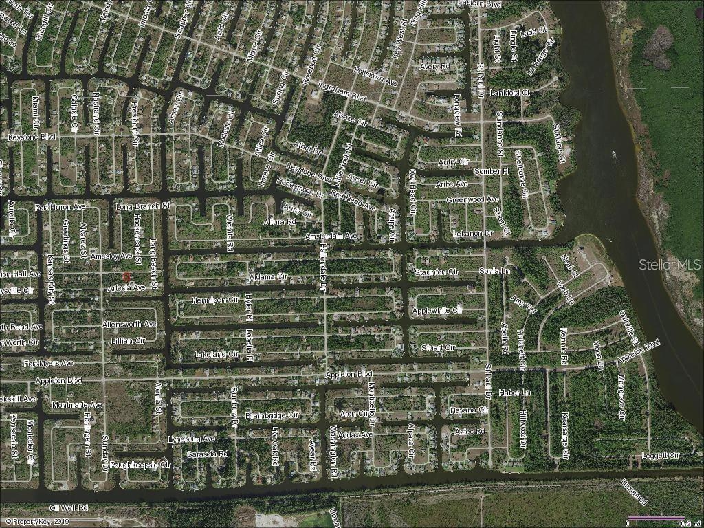 This is an aerial map view of a residential neighborhood with canal-front properties — 14407 MORRISTOWN AVENUE, PORT CHARLOTTE, FL