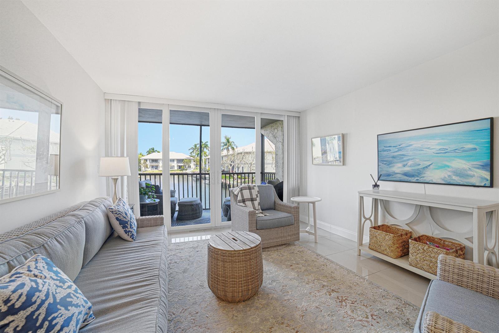 A circular swimming pool sits on a paved patio surrounded by lounge chairs and buildings — 6 Royal Palm Way # 211, Boca Raton FL 33432, BOCA RATON, FL