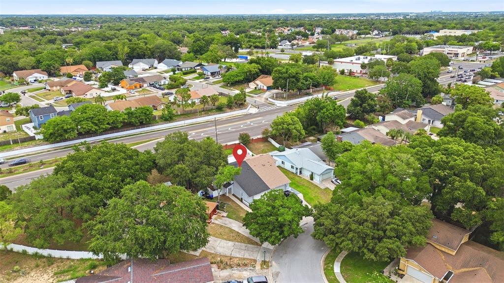 An aerial view shows a residential house with a red location pin on the roof — 7215 HARBOR HEIGHTS CIRCLE, ORLANDO, FL