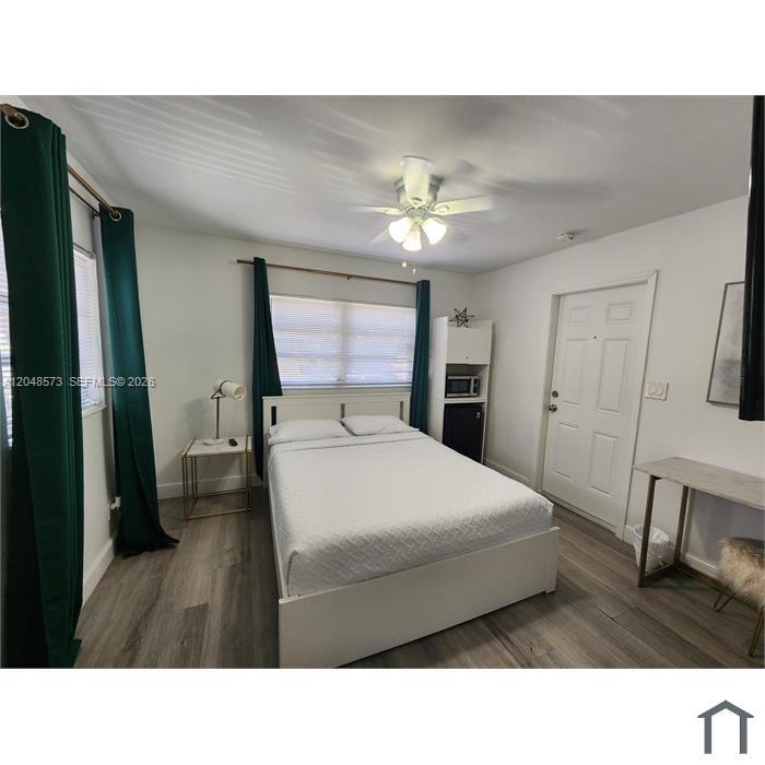 This is a view inside a small, empty closet with white walls and baseboards — 2032 NE 26th St # 3, Wilton Manors FL 33305, WILTON MANORS, FL
