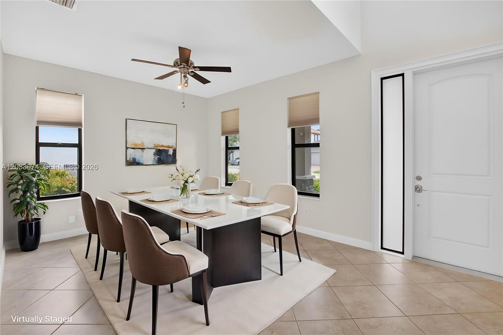 A dining room features a white table, six chairs, tile flooring, and a ceiling fan — 5836 Sandbirch Way, Lake Worth FL 33463, LAKE WORTH, FL