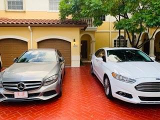 A silver Mercedes and a white Ford parked in the driveway of a yellow house — 4948 SW 136th Avenue, Miramar FL 33027, MIRAMAR, FL