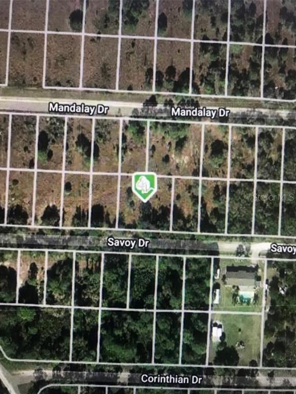 This aerial map shows vacant residential lots between Mandalay Drive, Savoy Drive, and Corinthian Drive — 27118 SAVOY DRIVE, PUNTA GORDA, FL