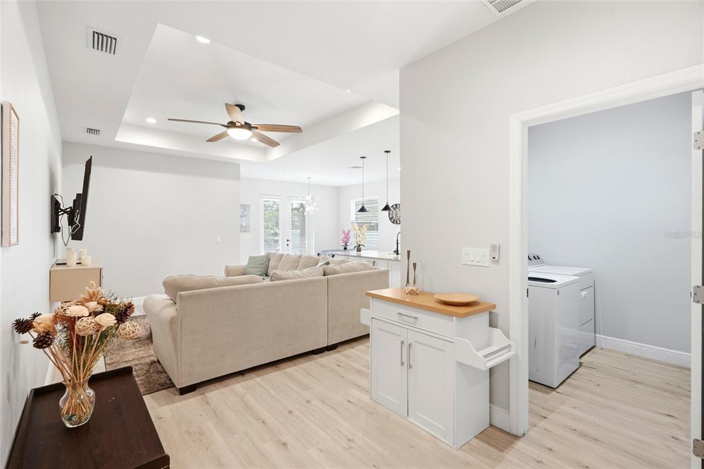 A modern kitchen features white cabinets, granite countertops, a large island, and stainless steel appliances — 4102 N 29TH STREET, TAMPA, FL