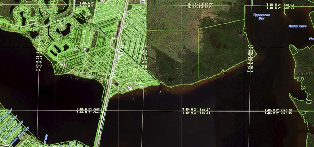 This is an aerial map showing a residential neighborhood bordering a body of water — 14484 ARMADA ROAD, PORT CHARLOTTE, FL