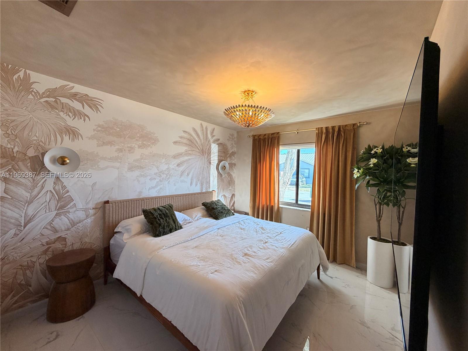 A bedroom features a palm-themed mural, a rattan bed frame, and gold curtains — 14617 SW 167th Ter, Miami FL 33177, MIAMI, FL