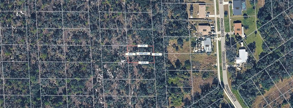 An aerial map view shows a rectangular plot of land highlighted with dimensions and square footage — 239 SAWFISH LANE, PUNTA GORDA, FL