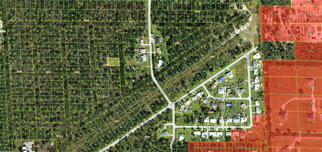 This is an aerial map showing a residential neighborhood with subdivided land plots and roads — 239 SAWFISH LANE, PUNTA GORDA, FL