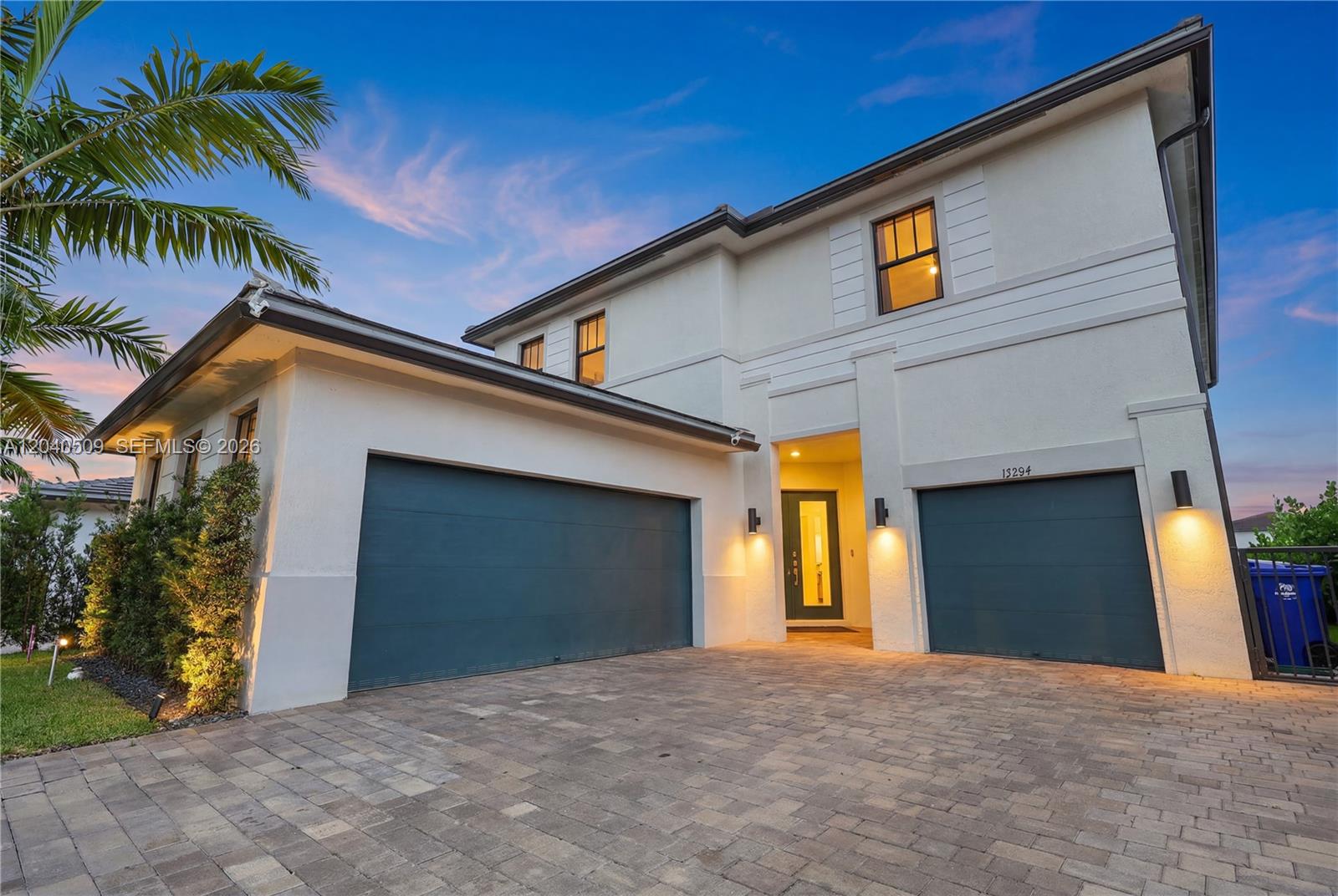 A two-story house with a paved driveway, two garage doors, and a front entryway — 17384 SW 41st St, Miramar FL 33029, MIRAMAR, FL