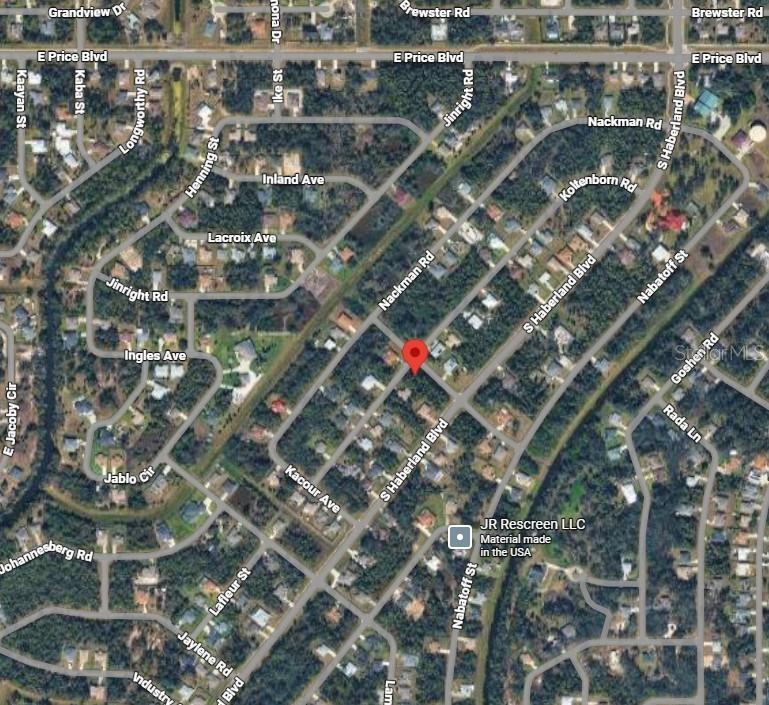 This is a satellite map view of a residential neighborhood with a red location pin — Lot 12 KAABE AVENUE, NORTH PORT, FL