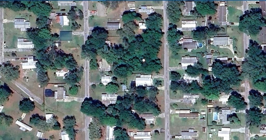 This is an aerial view of a residential neighborhood with houses, trees, and streets — SE 173RD COURT, SILVER SPRINGS, FL