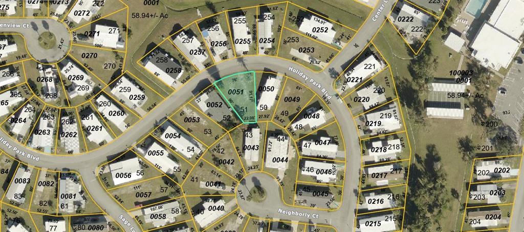 This is an aerial map showing property lot lines and parcel numbers in a residential neighborhood — 5708 HOLIDAY PARK BLVD, NORTH PORT, FL