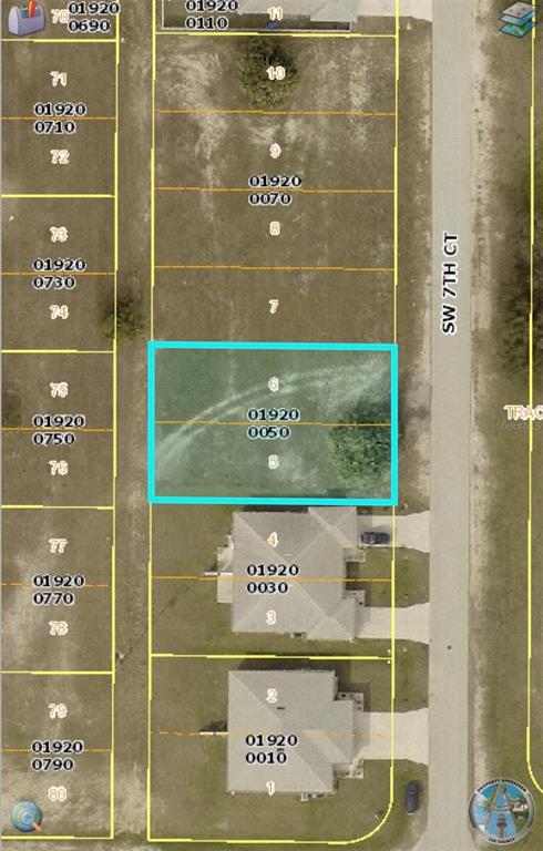 This is a satellite map view showing a vacant residential lot highlighted in blue — 1416 SW 7TH COURT, CAPE CORAL, FL