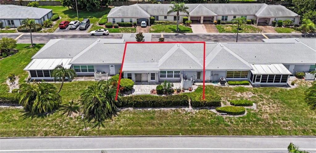 An aerial view of a single-story residential townhouse unit outlined in red — 8359 CANDLEWOOD ROAD UNIT 8359, SEMINOLE, FL