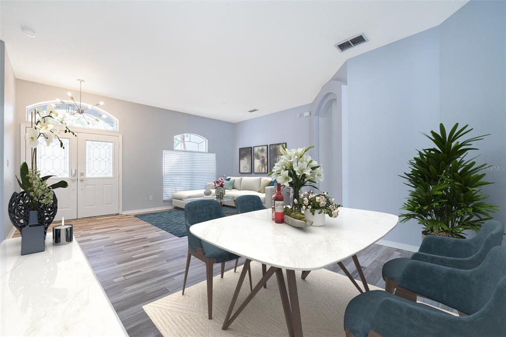 A bright, open-concept living and dining area features light blue walls and wood-look flooring — 8119 LAKE CROWELL CIRCLE, ORLANDO, FL