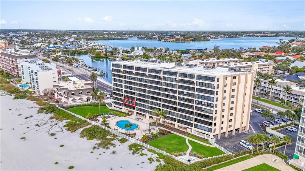 An aerial view of a beachfront condominium building with a red-outlined balcony — 840 THE ESPLANADE N UNIT 206, VENICE, FL