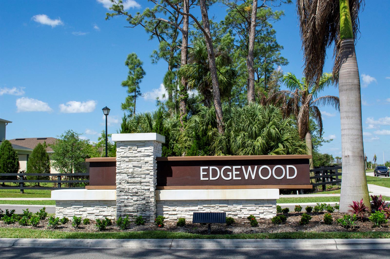 A stone and metal monument sign for Edgewood stands in a landscaped residential area — 560 Veridian Circle NW, Palm Bay FL 32907, PALM BAY, FL