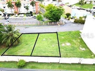 An aerial view shows two adjacent vacant rectangular lots outlined in black near a parking lot — HARBOUR DRIVE MARINA VIEW UNIT 2, HUMACAO, PR