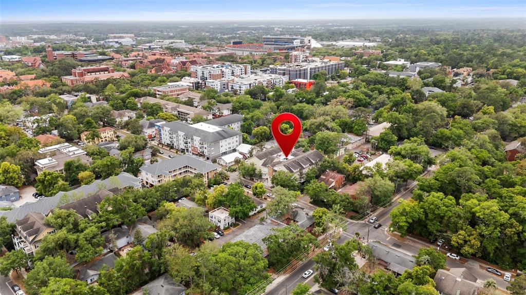 An aerial view shows a multi-story residential building marked with a red location pin — 1500 NW 4TH AVENUE UNIT 208, GAINESVILLE, FL
