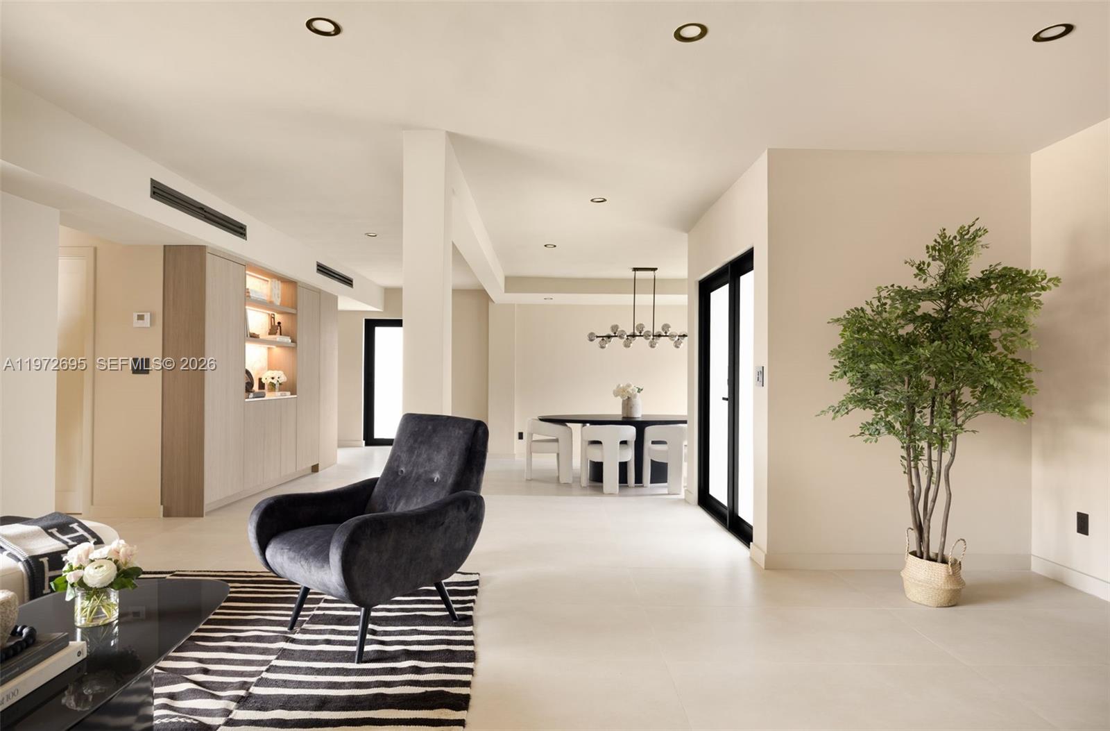 A two-story white house features a flat roof, a carport, and a landscaped front yard — 2805 SW 4th Ave, Miami FL 33129, MIAMI, FL