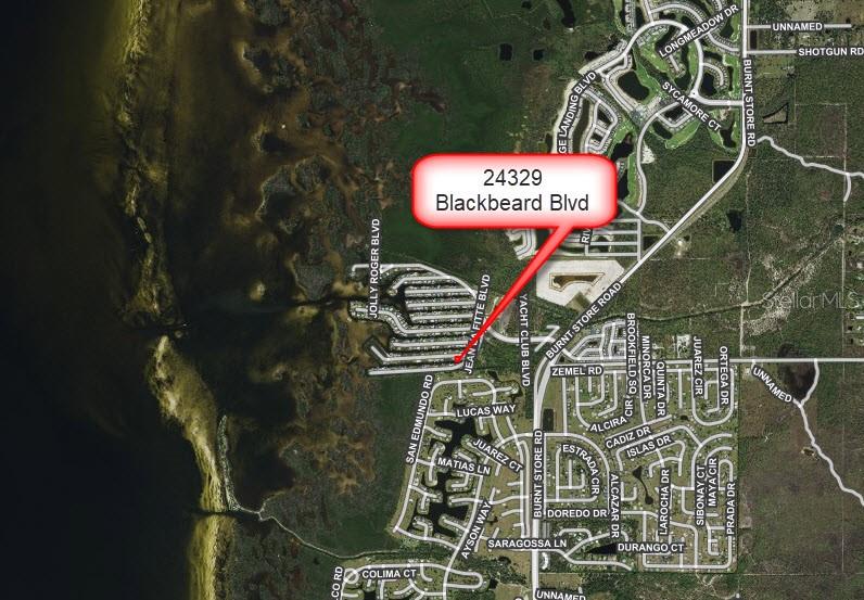 This is an aerial map showing the location of a property near a coastline — 24329 BLACKBEARD BOULEVARD, PUNTA GORDA, FL