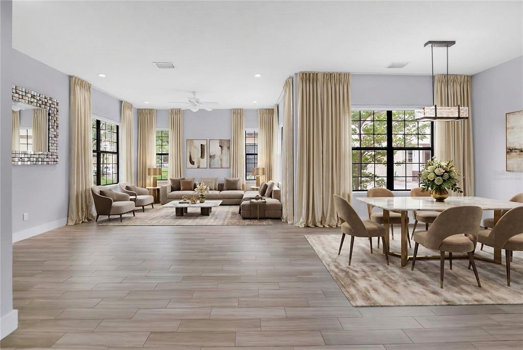 This open-concept living and dining room features light wood-look tile flooring and neutral-toned furnishings — 2251 NAIRN DRIVE, WINTER PARK, FL