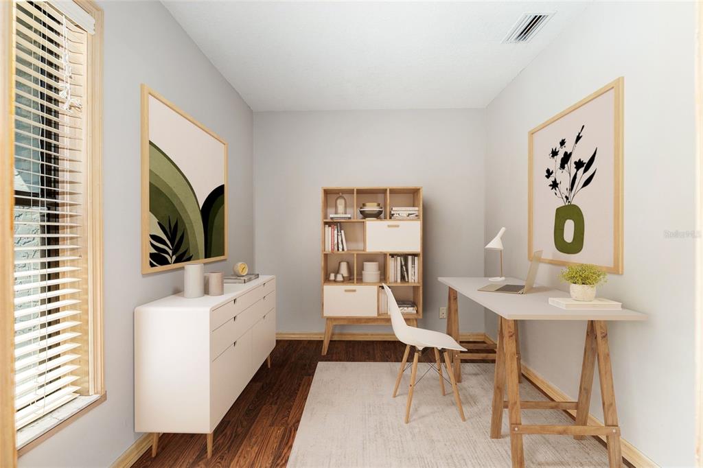 A home office features a white desk, a dresser, a bookshelf, and light-colored walls — 2023 SW 76TH TERRACE, GAINESVILLE, FL