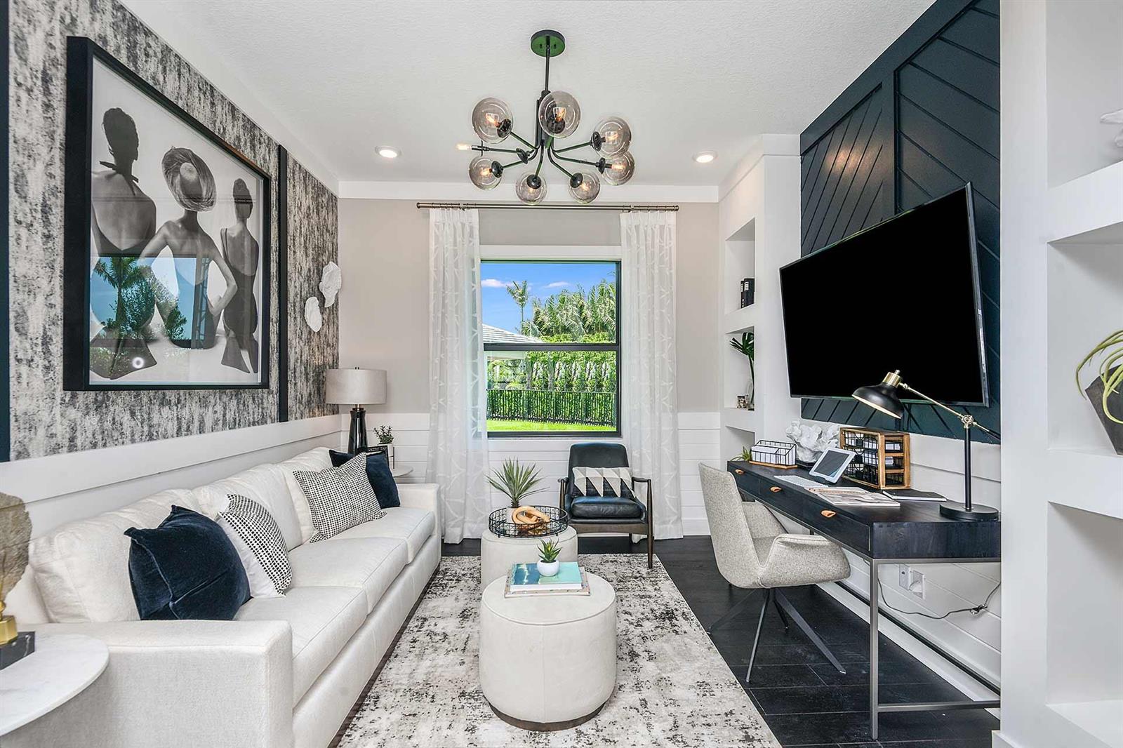 A home office features a white sofa, a desk, and a dark accent wall — 5633 Saint Armands Way, Westlake FL 33470, WESTLAKE, FL