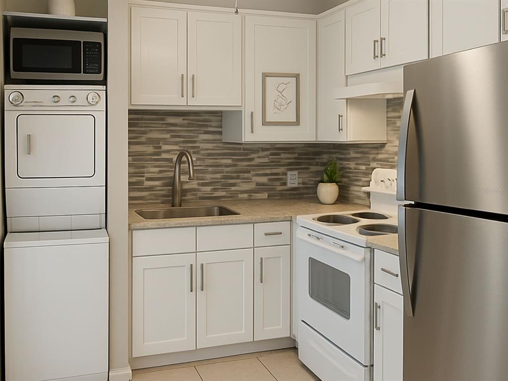 A compact kitchen features white cabinets, stainless steel appliances, a stacked washer-dryer, and tiled backsplash — 2359/2361 CHESTNUT HILLS DRIVE, LAKELAND, FL